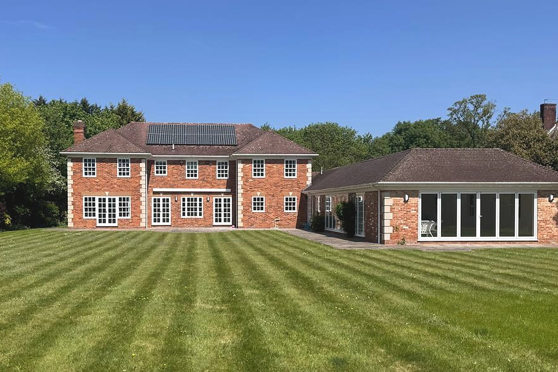 Renovated red-brick villa with manicured lawn in Stoke Poges
