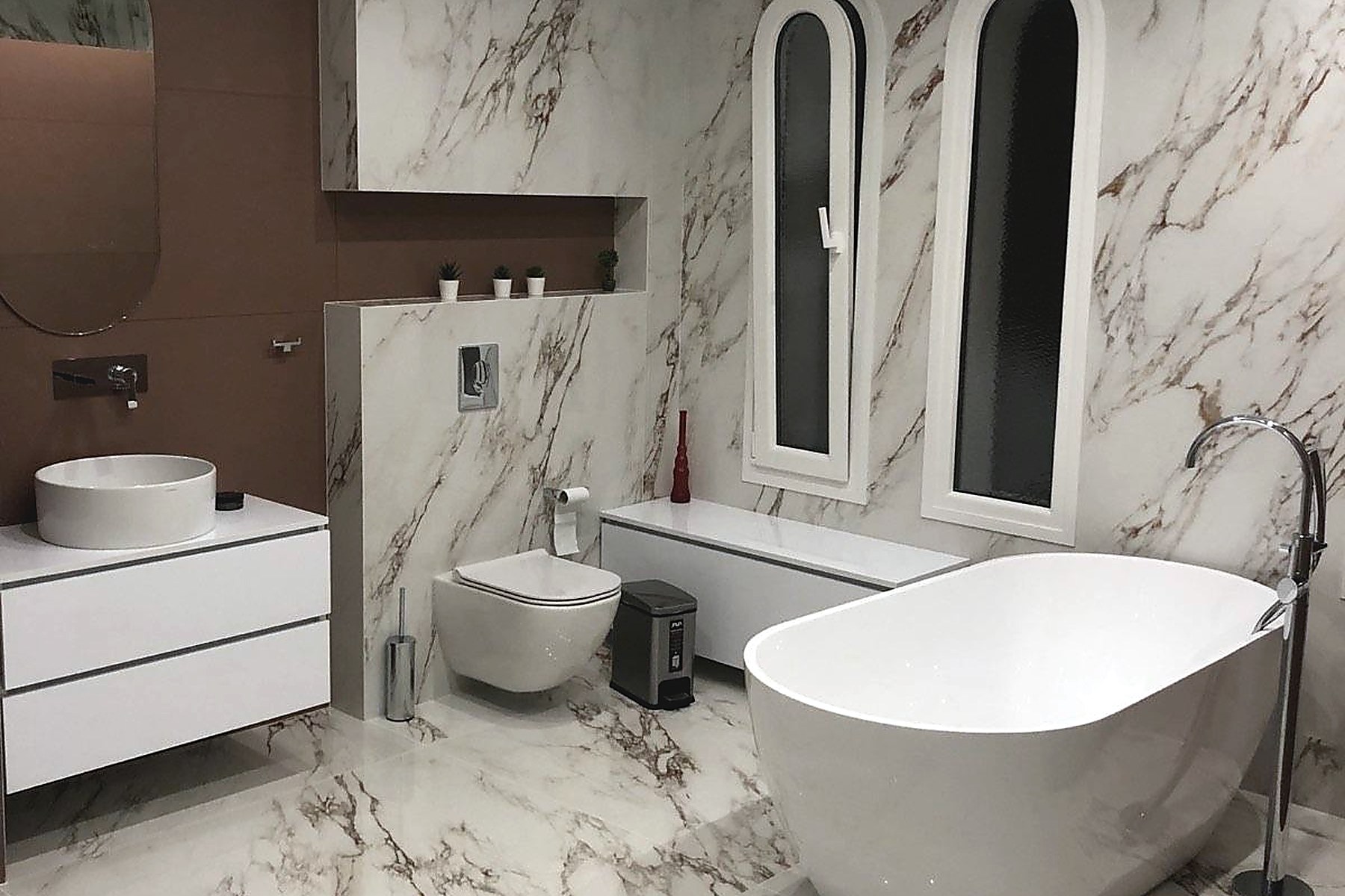 Calacatta marble bathroom with freestanding tub in West Hampstead